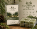 Cedar Trail Soy Candle & Wax Melts | Naturehouse Wax Company featuring eco-friendly soy wax melts in green tones with cedarwood, pine needle, moss, and amber scents, hand poured and inspired by nature.