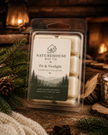 Fir & Firelight Wax Melts hand-poured from natural soy wax in a rustic setting with pine branches and warm firelight, evoking a cozy, eco-friendly atmosphere.