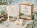 Sea Glass Wax Melts by Naturehouse Wax Company, hand poured, eco-friendly wax tarts with coastal citrus, marine air, and soft musk scent, displayed with natural sea glass and driftwood.